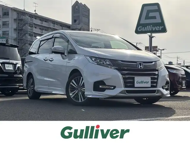 ホンダ オデッセイ ハイブリッド アブソルート ホンダセンシング 大分県 2019(令1)年 5.8万km プラチナホワイトパール ・純正ナビ(CD.DVD.SD.BT.USB)/・バックカメラ/・フルセグテレビ/・両側パワースライドドア/・レーダークルーズコントロール/・ETC 2.0/・ドライブレコーダー/・ハーフレザーシート/・運転席パワーシート/・ステアリングリモコン/・ブレーキホールド/・スマートキー