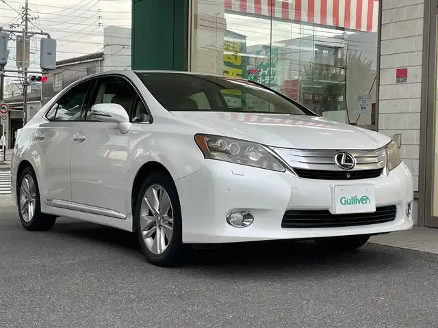 レクサス ＨＳ 250h バージョンI 愛知県 2010(平22)年 10.9万km ホワイトパールクリスタルシャイン 純正HDDナビ/・DVD／MD／MS／地デジTV/バックカメラ/ワイドビューフロントモニター/茶革シート/前席シートヒーター/シートベンチレーション/前席メモリ付パワーシート/クルーズコントロール/ウッドコンビステアリング/本木目パネル/電動リアサンシェード/ススマートキ×２＆カードキー/純正17インチAW/サイド＋カーテンエアバッグ