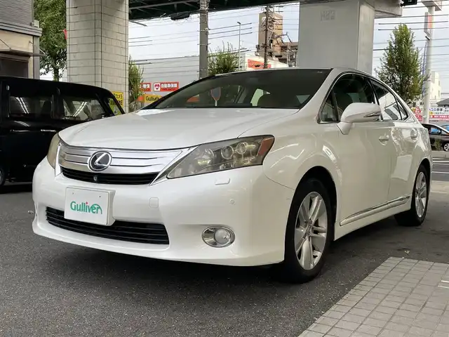 レクサス ＨＳ 250h バージョンI 愛知県 2010(平22)年 10.9万km ホワイトパールクリスタルシャイン 純正HDDナビ/・DVD／MD／MS／地デジTV/バックカメラ/ワイドビューフロントモニター/茶革シート/前席シートヒーター/シートベンチレーション/前席メモリ付パワーシート/クルーズコントロール/ウッドコンビステアリング/本木目パネル/電動リアサンシェード/ススマートキ×２＆カードキー/純正17インチAW/サイド＋カーテンエアバッグ