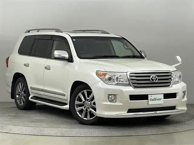 トヨタ ランドクルーザー ZX ブルーノクロス 道央・札幌 2015(平27)年 12.1万km ホワイトパールクリスタルシャイン ・ワンオーナー/・４WD/・純正HDDナビゲーション/　CD/DVD/HDD/BT/フルセグ/AUX/USB/・モデリスタエアロ（F・S・R）/・サンルーフ/・パワーバックドア/・スマートキー/・プッシュスタート/・保証書あり/・取説あり/・MTモード付AT/・クルーズコントロール/・横滑り防止装置/・前後コーナーセンサー/・全席パワーシート/・レザーシート/・前席シートヒーター/エアシート/・ステアリングヒーター/・ハイトコントロール/・電動格納サードシート/・純正フロアマット/・純正AW20インチ/・ダウンヒルアシストコントロール/・LEDヘッドライト/・フロントフォグランプ/・オートライト/・社外AW18インチスタッドレス積込/・センターコンソールクールボックス