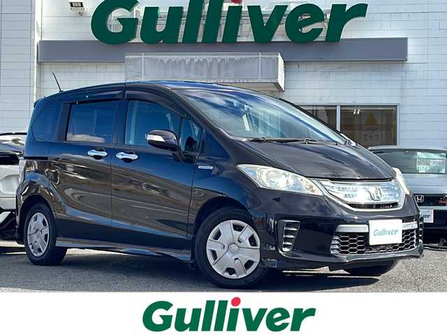 ホンダ フリード ハイブリット ジャストセレクション 三重県 2012(平24)年 9.7万km プレミアムブラキッシュパール 純正インターナビ/ワンセグTV/【CD/DVD/MSV】/バックカメラ/ビルトインETC/前後ドライブレコーダー/左側パワースライドドア/クルーズコントロール/オートライト/スマートキー/スペアキー/純正フロアマット