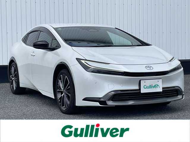 トヨタ プリウス Z 千葉県 2023(令5)年 3.6万km プラチナホワイトパールマイカ 純正12.3インチナビ/(フルセグTV BT FM AM HDMI)/全周囲カメラ/デジタルインナーミラー/ナビ連動前後ドライブレコーダー/ブラインドスポットモニター/置くだけ充電/メモリー付きパワーシート/衝突被害軽減システム/車線逸脱警報/クルーズコントロール/レザーシート/横滑り防止装置/ビルトインETC2.0/アイドリングストップ/LEDヘッドライト/オートライト/ウィンカーミラー/電動格納ミラー/純正19インチAW/シートヒーター/エアシート/シートリフター/ステアリングヒーター/TVキャンセラー/プッシュスタート/スマートキー/フロアマット/ドアバイザー/スペアキー/保証書
