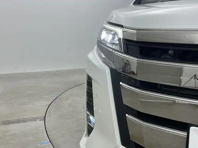 トヨタ ノア ハイブリッド Si ダブルバイビーⅡ 岡山県 2019(令1)年 6.2万km ホワイトパールクリスタルシャイン 純正9型ナビ（NSZT-Y68T）/【フルセグTV/CD/DVD/BT】/バックカメラ/純正12.1インチフリップダウンモニター/両側パワースライドドア/トヨタセーフティセンス/クルーズコントロール/ビルトインETC/ステアリングリモコン/ハーフレザーシート/D/Nシートヒーター/LEDオートライト/フォグランプ/スマートキー/プッシュスタート/フロアマット/純正ドアバイザー