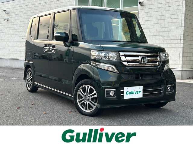 ホンダ Ｎ ＢＯＸ カスタム SSパッケージ 鳥取県 2016(平28)年 3.2万km ブリティッシュグリーンP 純正ギャザーズナビ/バックカメラ/フルセグＴＶ　ＤＶＤ　ＣＤ　ＳＤ　Ｂｌｕｅｔｏｏｔｈ/ナビ装着用スペシャルパッケージ/・ETC車載器(ナビ連動)/・オートエアコン（プラズマクラスター搭載）/・アレルクリーンシート/・運転席シートハイトアジャスター/・車速連動バリアブル間欠ワイパー/・リア左側パワースライドドア/・リアシートスライド/・シートバックテーブル/・リア右側パワースライドドア/あんしんパッケージ/・ディスチャージヘッドライト/・オートライトコントロール機構付/・オートリトラミラー/・ハーフシェイドフロントウィンドウ/・14インチアルミホイール/・360°スーパーUV・IRカットパッケージ/・リア席サンシェード/・ヒーテッドドアミラー/・フロントドア撥水ガラス/・シートヒーター/・LEDルームランプ/・エアコンアウトレットダブルリング(クロームメッキ)/・LEDフォグライト/・LEDポジションランプ/・フォグライトガーニッシュ/フロアマット/スマートキー/新車保証書/取扱説明書