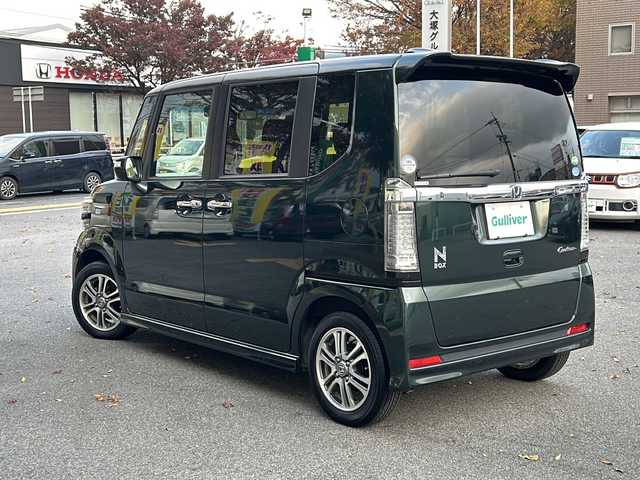 ホンダ Ｎ ＢＯＸ カスタム SSパッケージ 鳥取県 2016(平28)年 3.2万km ブリティッシュグリーンP 純正ギャザーズナビ/バックカメラ/フルセグＴＶ　ＤＶＤ　ＣＤ　ＳＤ　Ｂｌｕｅｔｏｏｔｈ/ナビ装着用スペシャルパッケージ/・ETC車載器(ナビ連動)/・オートエアコン（プラズマクラスター搭載）/・アレルクリーンシート/・運転席シートハイトアジャスター/・車速連動バリアブル間欠ワイパー/・リア左側パワースライドドア/・リアシートスライド/・シートバックテーブル/・リア右側パワースライドドア/あんしんパッケージ/・ディスチャージヘッドライト/・オートライトコントロール機構付/・オートリトラミラー/・ハーフシェイドフロントウィンドウ/・14インチアルミホイール/・360°スーパーUV・IRカットパッケージ/・リア席サンシェード/・ヒーテッドドアミラー/・フロントドア撥水ガラス/・シートヒーター/・LEDルームランプ/・エアコンアウトレットダブルリング(クロームメッキ)/・LEDフォグライト/・LEDポジションランプ/・フォグライトガーニッシュ/フロアマット/スマートキー/新車保証書/取扱説明書