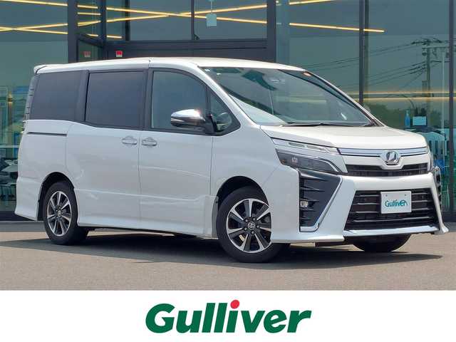 トヨタ ヴォクシー ZS 煌Ⅱ 東京都 2020(令2)年 2万km ホワイトパールクリスタルシャイン 純正9インチナビ/フリップダウンモニター/両側パワースライドドア/フルセグ/バックカメラ/ビルトインETC/ドライブレコーダー/衝突軽減ブレーキ/レーンキープアシスト/クルーズコントロール/コーナーセンサー/オートマチックハイビーム/LEDヘッドライト/スマートキー