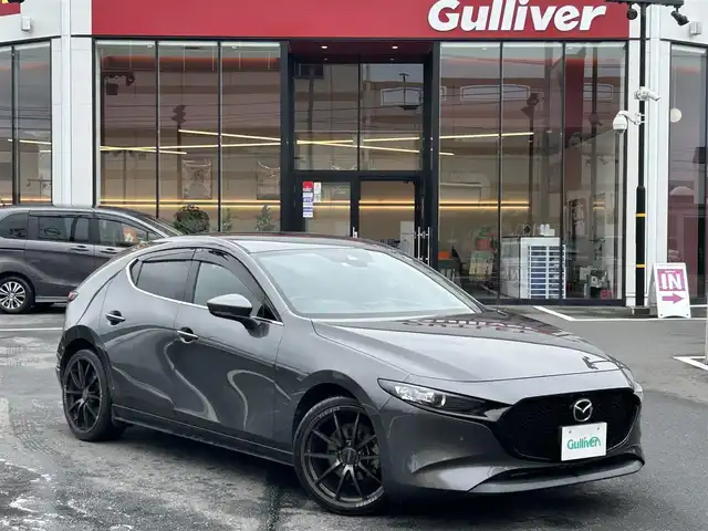 マツダ マツダ３ファストバック 15S ツーリング 宮城県 2019(令1)年 4.4万km マシーングレープレミアムM 登録時走行距離44086km/純正ナビ/FM・AM・TV・Bluetooth・CD・DVD・SD/アラウンドビューモニター/ETC/クルーズコントロール/６速マニュアル/クリアランスソナー/オートホールド機能/アイドリングストップ/スマートキー/スペアキーあり/社外アルミホイール/純正フロアマット/電動格納ミラー/オートライト/フルフラットシート/ドアバイザー