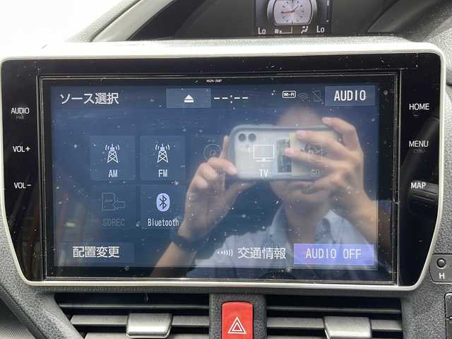 トヨタ ヴォクシー ZS 煌Ⅱ 沖縄県 2019(平31)年 7.7万km ブラッキッシュアゲハガラスフレーク 純正ナビ・TV・Bluetooth・CD・DVD/両側パワースライドドア/バックカメラ/ETC/ドライブレコーダー/コーナーセンサー/オートライト/衝突軽減システム/純正アルミ/フォグランプ/革巻きステアリング/ステアリングスイッチ