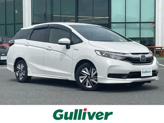 ホンダ シャトル ハイブリッド ホンダセンシング 奈良県 2021(令3)年 5.3万km プラチナホワイトパール メモリナビ　/バックカメラ　/追従クルーズコントロール　/Bluetooth　/ETC　/衝突軽減システム　/レーンキープアシスト　/スマートキー　/スペアキー1本　/オートライト　/純正アルミホイール　/横滑り防止装置