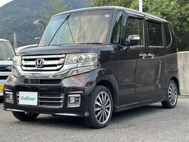 ホンダ Ｎ ＢＯＸ カスタム G ターボ Lパッケージ 長崎県 2016(平28)年 8.5万km トワイライトミストブラックパール 社外SDナビ(FM/AM/BT/フルセグTV)/ターボ/プッシュスタート/ビルトインETC/バックカメラ/両側パワースライドドア/パドルシフト/アイドリングストップ/ステアリングスイッチ/ハーフレザーシート/純正フロアマット/純正アルミホイール/オートライト/ABS/TCS/VSA/イモビライザー/スマートキー/電動格納ミラー