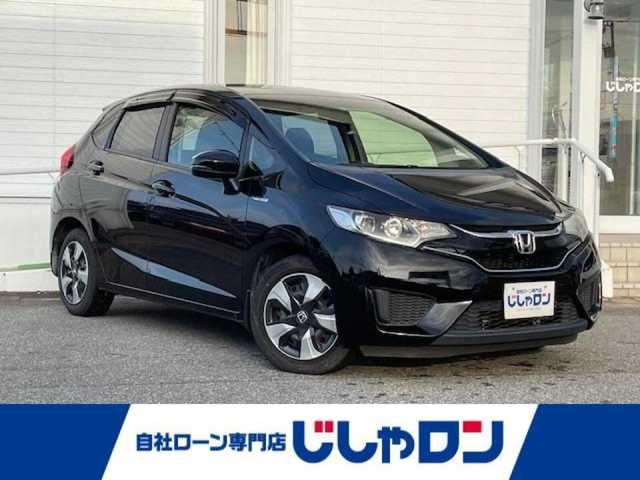 ホンダ フィット ハイブリット Fパッケージ 富山県 2015(平27)年 9.9万km クリスタルブラックパール (株)IDOMが運営する【じしゃロン富山店】の自社ローン専用車両になります。こちらは現金またはオートローンご利用時の価格です。自社ローンご希望の方は別途その旨お申し付け下さい/純正ナビ/バックカメラ/ETC/オートリトラミラー/横滑り防止/LEDヘッドライト/オートライト/プッシュスタート/スマートキー/スペアキー1本