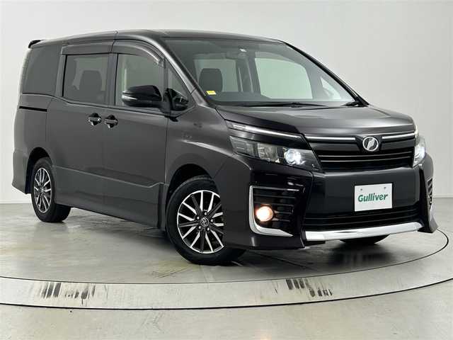 トヨタ ヴォクシー ZS 埼玉県 2014(平26)年 7万km ボルドーマイカメタリック 純正ナビ(NSZT-Y62G)/フルセグ/Bluetooth/CD/DVD/バックカメラ/両側パワースライドドア/ステアリングリモコン/電格ウィンカーミラー/純正フロアマット/LEDヘッドライト/オートライト/純正16インチアルミホイール