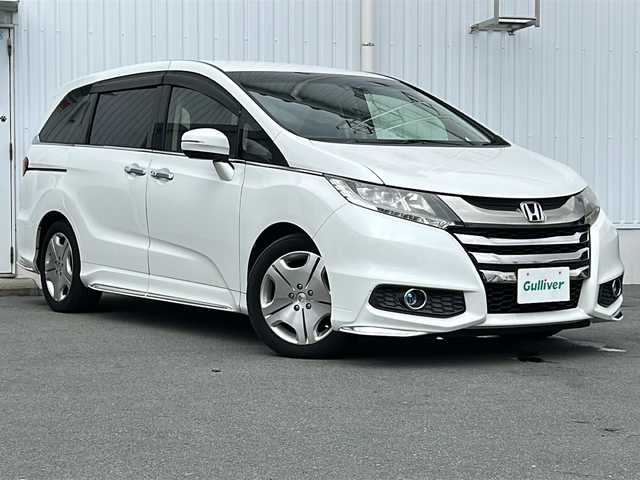 ホンダ オデッセイ アブソルート 三重県 2015(平27)年 12.8万km ホワイトオーキッドパール 純正８型ナビ　/バックカメラ　/両側パワースライドドア/ビルトインETC/レーダークルーズコントロール /レーンキープアシスト /アイドリングストップ/ホンダセンシング /前方ドライブレコーダー/LEDヘッドライト /オートライト /ステアリングスイッチ /ハーフレザーシート/電動格納ミラー /禁煙車