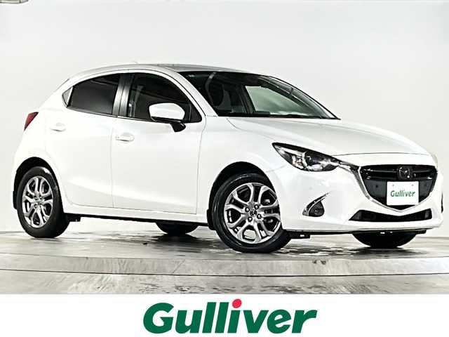 マツダ デミオ XD ノーブルクリムゾン 広島県 2018(平30)年 2.8万km スノーフレイクホワイトパールマイカ 禁煙車/３６０°ビュー・モニター＋フロントパーキングセンサー（センター／コーナー）/アダプティブ・ＬＥＤ・ヘッドライト/スマート・ブレーキ・サポート＆マツダ・レーダー・クルーズ・コントロール/BSM/マツダコネクトナビ/・フルセグ/CD/DVD/Bluetooth/USB/AUX/革巻きステアリング/ステアリングスイッチ/オートライト/パドルシフト/シートヒーター/LEDヘッドライト/スマートキー/プッシュスタート/スペアキー/トノカバー/専用シート（カラー：レッド（千鳥格子））/ETC２．０/ドライブレコーダー配線無しのため動作確認できず/純正フロアマット/純正16インチアルミホイール