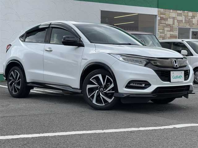 ホンダ ヴェゼル ハイブリッド RS ホンダセンシング 愛知県 2019(令1)年 5.1万km プラチナホワイトパール 純正8インチナビ(VXM-195VFi)/（CD・DVD/フルセグTV）/バックカメラ/純正ビルトインETC/純正18インチアルミホイール/衝突被害軽減ブレーキ/追従機能付クルーズコントロール/レーンキープアシスト/ハーフレザーシート/前席シートヒーター/LEDヘッドライト/オートライト/スマートキー/純正フロアマット/LEDスピーカーリング