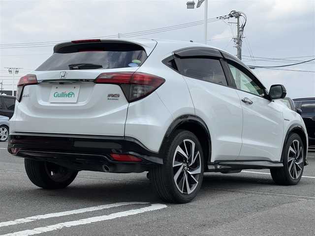 ホンダ ヴェゼル ハイブリッド RS ホンダセンシング 愛知県 2019(令1)年 5.1万km プラチナホワイトパール 純正8インチナビ(VXM-195VFi)/（CD・DVD/フルセグTV）/バックカメラ/純正ビルトインETC/純正18インチアルミホイール/衝突被害軽減ブレーキ/追従機能付クルーズコントロール/レーンキープアシスト/ハーフレザーシート/前席シートヒーター/LEDヘッドライト/オートライト/スマートキー/純正フロアマット/LEDスピーカーリング