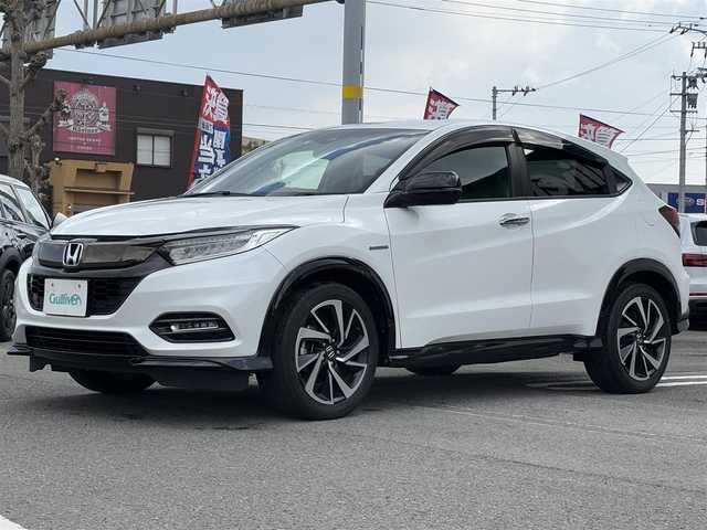 ホンダ ヴェゼル ハイブリッド RS ホンダセンシング 愛知県 2019(令1)年 5.1万km プラチナホワイトパール 純正8インチナビ(VXM-195VFi)/（CD・DVD/フルセグTV）/バックカメラ/純正ビルトインETC/純正18インチアルミホイール/衝突被害軽減ブレーキ/追従機能付クルーズコントロール/レーンキープアシスト/ハーフレザーシート/前席シートヒーター/LEDヘッドライト/オートライト/スマートキー/純正フロアマット/LEDスピーカーリング