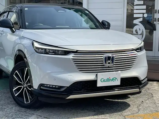 ホンダ ヴェゼル ハイブリッド e:HEV PLaY 神奈川県 2021(令3)年 2.2万km プレミアムサンライトホワイトパール ワンオーナー/純正CONNECTナビ/　（Bluetooth・USB）/フルセグTV/全方位モニター/ホンダセンシング/アダプティブクルーズコントロール/パノラマルーフ/置くだけ充電/ステアリングヒーター/前席シートヒーター/ハーフレザーシート/LEDヘッドライト/LEDフォグライト/パワーバックドア/ブラインドスポットモニター/コーナーセンサー/ビルトインETC/スマートキー×2/保証書/取扱説明書
