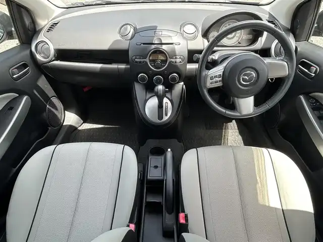 マツダ デミオ 13C－V 愛知県 2009(平21)年 4.9万km メトロポリタングレーマイカ ワンオーナー/純正オーディオ(FM/AM/CD/AUX)/電動格納ミラー/ETC/純正フロアマット/リモコンキー/ステアリングリモコン/ABS/保証書