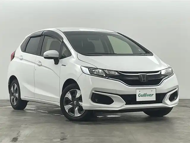 ホンダ フィット ハイブリット F 福島県 2020(令2)年 4.9万km タフタホワイトⅢ ホンダセンシング　/・ＡＣＣ　/・ＣＭＢＳ　/・ＬＫＡＳ　/・誤発進抑制機能　/・歩行者事故低減ステアリング　/・先行先行車発進お知らせ機能　/純正オーディオ　/・USB/CD/AM・FM/AUX/・ETC/ステアリングスイッチ　/プッシュスタート/・スマートキー/ハロゲンライト/・オートライト/・ヘッドライトリベライザー/電動格納ウィンカーミラー/・オートミラー/ドアバイザー