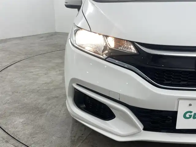ホンダ フィット ハイブリット F 福島県 2020(令2)年 4.9万km タフタホワイトⅢ ホンダセンシング　/・ＡＣＣ　/・ＣＭＢＳ　/・ＬＫＡＳ　/・誤発進抑制機能　/・歩行者事故低減ステアリング　/・先行先行車発進お知らせ機能　/純正オーディオ　/・USB/CD/AM・FM/AUX/・ETC/ステアリングスイッチ　/プッシュスタート/・スマートキー/ハロゲンライト/・オートライト/・ヘッドライトリベライザー/電動格納ウィンカーミラー/・オートミラー/ドアバイザー