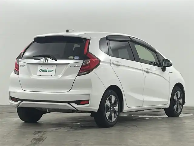 ホンダ フィット ハイブリット F 福島県 2020(令2)年 4.9万km タフタホワイトⅢ ホンダセンシング　/・ＡＣＣ　/・ＣＭＢＳ　/・ＬＫＡＳ　/・誤発進抑制機能　/・歩行者事故低減ステアリング　/・先行先行車発進お知らせ機能　/純正オーディオ　/・USB/CD/AM・FM/AUX/・ETC/ステアリングスイッチ　/プッシュスタート/・スマートキー/ハロゲンライト/・オートライト/・ヘッドライトリベライザー/電動格納ウィンカーミラー/・オートミラー/ドアバイザー