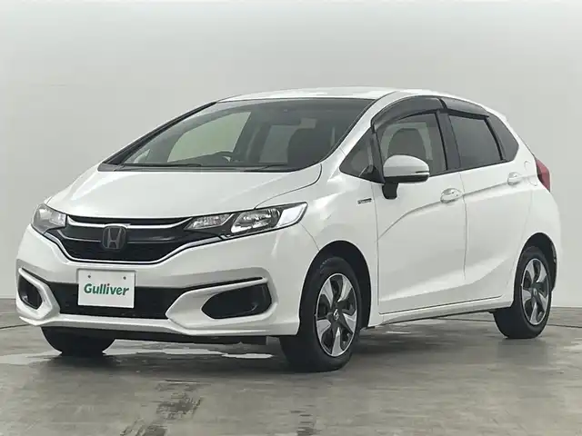 ホンダ フィット ハイブリット F 福島県 2020(令2)年 4.9万km タフタホワイトⅢ ホンダセンシング　/・ＡＣＣ　/・ＣＭＢＳ　/・ＬＫＡＳ　/・誤発進抑制機能　/・歩行者事故低減ステアリング　/・先行先行車発進お知らせ機能　/純正オーディオ　/・USB/CD/AM・FM/AUX/・ETC/ステアリングスイッチ　/プッシュスタート/・スマートキー/ハロゲンライト/・オートライト/・ヘッドライトリベライザー/電動格納ウィンカーミラー/・オートミラー/ドアバイザー
