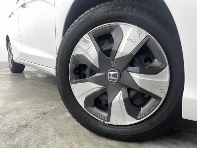 ホンダ フィット ハイブリット F 福島県 2020(令2)年 4.9万km タフタホワイトⅢ ホンダセンシング　/・ＡＣＣ　/・ＣＭＢＳ　/・ＬＫＡＳ　/・誤発進抑制機能　/・歩行者事故低減ステアリング　/・先行先行車発進お知らせ機能　/純正オーディオ　/・USB/CD/AM・FM/AUX/・ETC/ステアリングスイッチ　/プッシュスタート/・スマートキー/ハロゲンライト/・オートライト/・ヘッドライトリベライザー/電動格納ウィンカーミラー/・オートミラー/ドアバイザー