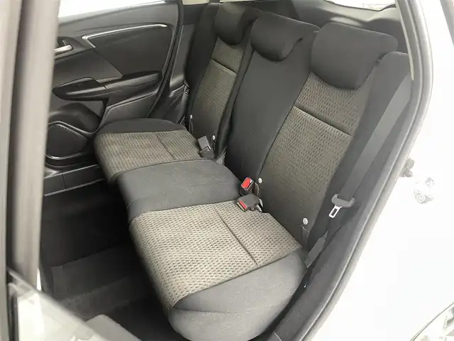 ホンダ フィット ハイブリット F 福島県 2020(令2)年 4.9万km タフタホワイトⅢ ホンダセンシング　/・ＡＣＣ　/・ＣＭＢＳ　/・ＬＫＡＳ　/・誤発進抑制機能　/・歩行者事故低減ステアリング　/・先行先行車発進お知らせ機能　/純正オーディオ　/・USB/CD/AM・FM/AUX/・ETC/ステアリングスイッチ　/プッシュスタート/・スマートキー/ハロゲンライト/・オートライト/・ヘッドライトリベライザー/電動格納ウィンカーミラー/・オートミラー/ドアバイザー