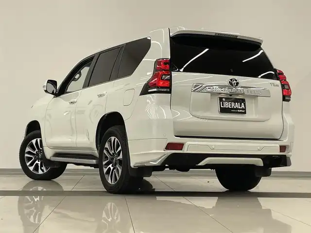 トヨタ ランドクルーザー プラド TZ－G 岡山県 2022(令4)年 2.7万km ホワイトパールクリスタルシャイン モデリスタエアロ/サンルーフ/トヨタセーフティセンス/・衝突軽減ブレーキ/・車線逸脱警報（レーンキープアシスト）/・オートマチックハイビーム/・レーダークルーズコントロール/・ブラインドスポットモニター/純正ナビ（T-Connect)/フルセグTV（AM.FM.TV.BT）/４WD/全方位カメラ/パワーシート（D+N席）/シートヒーター（D+N席）/シートエアコン（D+N席）/センターデフロック/サイドステップ/ヒルディセントコントロール/電動コラム/ETC2.0/アイドリングストップ/１９インチ純正AW/純正フロアマット