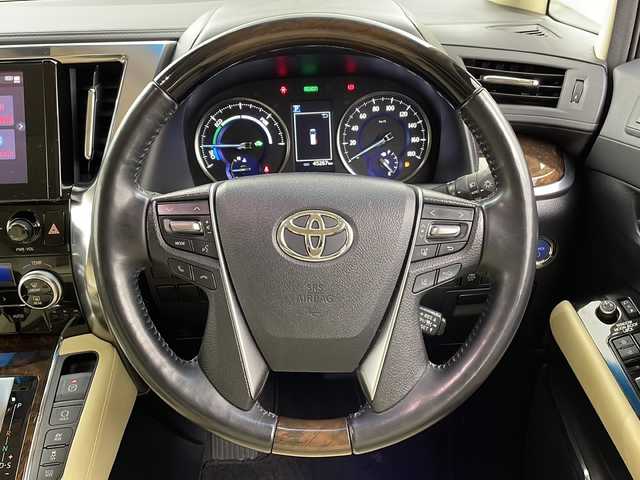 トヨタ アルファードハイブリット G Fパッケージ 大阪府 2023(令5)年 4.6万km ホワイトパールクリスタルシャイン ツインムーンルーフ/１２．１型後席モニター/純正９型ＤＡナビ/デジタルミラー/バックカメラ/ドライブレコーダー/ETC/ＴｏｙｏｔａＳａｆｅｔｙＳｅｎｓｅ/・プリクラッシュセーフティ/・レーントレーシングアシスト/・レーダークルーズコントロール/・ロードサインアシスト/・アダプティブハイビームシステム/ブラインドスポットモニター/パワーバックドア/両側パワースライドドア/メモリシート/シートヒーター/シートクーラー/ステアリングヒーター/パワーシート/純正AW/スペアキー/純正フロアマット