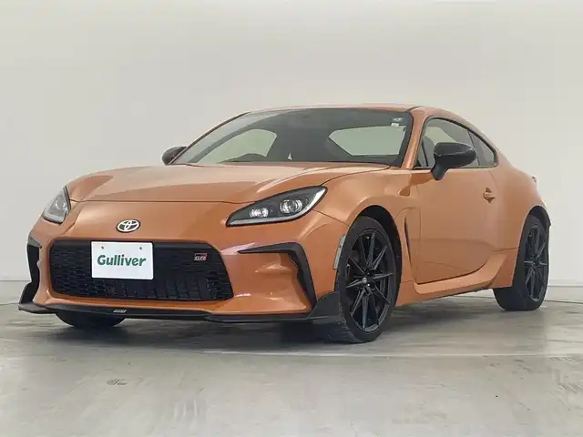 トヨタ ＧＲ８６ RZ 10thアニバーサリーLTD 群馬県 2023(令5)年 2.2万km フレイムオレンジ 特別仕様車　10thアニバーサリーリミテッド/＝＝＝＝＝＝/TOMSエアロ（フロント/トランク）/社外エクリプスナビ（AVN-LS02W)/・CD/DVD/Bluetooth/フルセグTV/バックカメラ/ハーフレザーシート/シートヒーター /クルーズコントロール/左右独立温度コントロールフルオートエアコン/Bi-Beam LEDヘッドランプ/（オートレベリング機能付＋LEDクリアランスランプ＋LEDターンランプ）/Rフォグランプ /マクファーソンストラット式フロントサスペンション/ダブルウィッシュボーン式リヤサスペンション/トルセンLSD（リミテッド・スリップ・デフ）/純正18インチアルミホイール/スマートキー /ETC/自動防眩ミラー