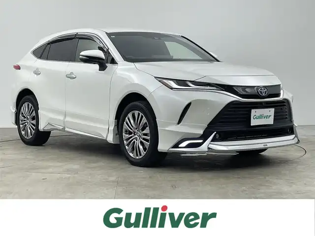 トヨタ ハリアー ハイブリッド Z レザーパッケージ 千葉県 2021(令3)年 3.2万km ホワイトパールクリスタルシャイン 禁煙車/ワンオーナー/トヨタセーフティセンス/・レーンディパーチャーアラート/・レーンキープアシスト/・プリクラッシュセーフティ/・プリクラッシュセーフティブレーキ/・ブラインドスポットモニター/・ヘッドアップディスプレイ/・クリアランスソナー/・レーダークルーズコントロール/モデリスタエアロ/JBLプレミアムサウンドシステム/パワーバックドア/デジタルインナーミラー/純正12.3インチディスプレイオーディオ/・コネクティッドナビ/・AUX/USB/Bluetooth/フルセグTV/・全方位カメラ/・ビルトインETC2.0/革巻きステアリング/・ステアリングスイッチ/・ステアリングヒーター/レザーシート/・DNパワーシート/・D席メモリ付き/・DNシートヒーター/・DNエアーシート/MT付きAT/純正フロアマット/純正19インチAW/オートライト/・オートマチックハイビーム/・LEDヘッドライト/・LEDフォグランプ