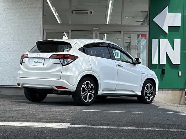 ホンダ ヴェゼル ハイブリッド Z 愛知県 2014(平26)年 8.4万km ホワイトオーキッドパール 禁煙車/ワンオーナー/純正インターナビ/ハーフレザーシート/寒冷地仕様/クルーズコントロール/パドルシフト/バックカメラ/パーキングアシスト/フルセグ/Bluetooth/ステアリングリモコン/HDMI/BREAKHOLD/シートヒーター（D/N席）/ECON/オートライト/フォグランプ/ドアバイザー/純正アルミ/純正フロアマット/ETC/スペアキー/取扱説明書/保証書