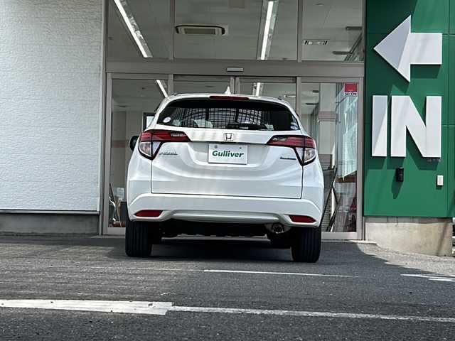 ホンダ ヴェゼル ハイブリッド Z 愛知県 2014(平26)年 8.4万km ホワイトオーキッドパール 禁煙車/ワンオーナー/純正インターナビ/ハーフレザーシート/寒冷地仕様/クルーズコントロール/パドルシフト/バックカメラ/パーキングアシスト/フルセグ/Bluetooth/ステアリングリモコン/HDMI/BREAKHOLD/シートヒーター（D/N席）/ECON/オートライト/フォグランプ/ドアバイザー/純正アルミ/純正フロアマット/ETC/スペアキー/取扱説明書/保証書