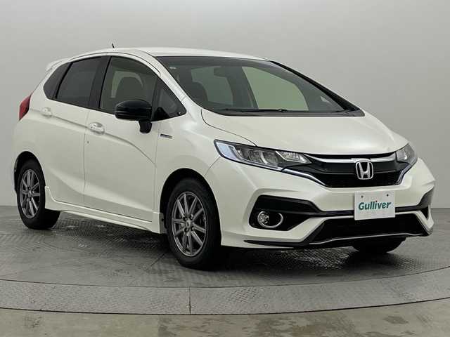 ホンダ フィット ハイブリット Sパッケージ 新潟県 2017(平29)年 2.6万km プレミアムホワイトパールⅡ 社外ナビ/　　フルセグ/CD/DVD/BT/バックカメラ/クルーズコントロール/LEDオートライト/純正アルミホイール車載/社外AW付サマータイヤ車載/ステアリングスイッチ/パドルシフト/アイドリングストップ/スマートキー/ETC