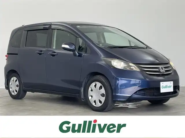 ホンダ フリード G ジャストセレクション 埼玉県 2009(平21)年 7.1万km プレミアムナイトブルーパール 社外7インチナビ/ CD DVD フルセグTV Bluetooth/バックカメラ/片側パワースライドドア/革調シートカバー/純正フロアマット/ドアバイザー/オートライト/スマートキー/ETC