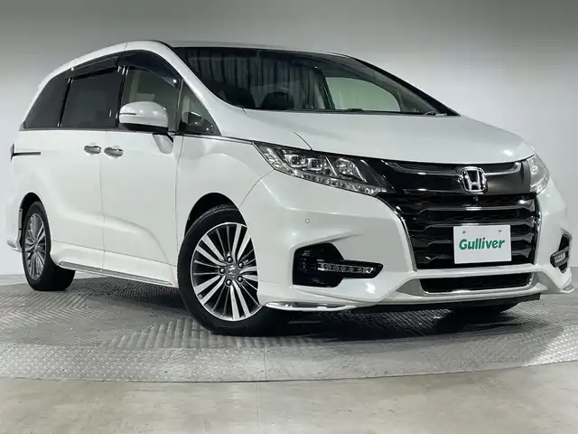 ホンダ オデッセイ アブソルート・EXホンダセンジング 神奈川県 2019(令1)年 2.2万km プラチナホワイトパール ホンダセンシング/純正8型SDナビゲーション【VXM-197VFNi】/・BT/フルセグTV/CD/DVD/SD/USB/HDMI/全方位モニター/パーキングアシスト/両側電動スライドドア/ハーフレザーシート/パワーシート(D/N)/シートヒーター(D/N)/二列目オットマン/ビルトインETC2.0/前後ドライブレコーダー/スマートキー/スペアキー/プッシュスタートボタン/革巻きステアリング/ステアリングスイッチ/パドルシフト/Autoライト/ECON/コーナーセンサー/LEDヘッドライト/フォグランプ/電動格納ミラー/ウィンカーミラー/純正フロアマット/純正ドアバイザー/純正17インチアルミホイール
