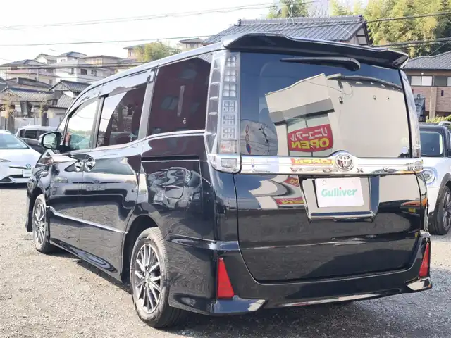 トヨタ ヴォクシー ZS 煌Ⅱ 熊本県 2016(平28)年 10万km ブラック 純正9インチナビ（NSZT-Y66T）/【フルセグTV/Bluetooth/CD/DVD/HDMI】/バックカメラ/純正12.1インチフリップダウンモニター/両側パワースライドドア/衝突被害軽減システム/車線逸脱警報/オートLEDヘッドライト/プッシュスタート/スマートキー/純正16インチAW/ドライブレコーダー/ETC/ウインカーミラー