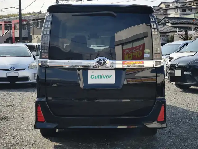 トヨタ ヴォクシー ZS 煌Ⅱ 熊本県 2016(平28)年 10万km ブラック 純正9インチナビ（NSZT-Y66T）/【フルセグTV/Bluetooth/CD/DVD/HDMI】/バックカメラ/純正12.1インチフリップダウンモニター/両側パワースライドドア/衝突被害軽減システム/車線逸脱警報/オートLEDヘッドライト/プッシュスタート/スマートキー/純正16インチAW/ドライブレコーダー/ETC/ウインカーミラー