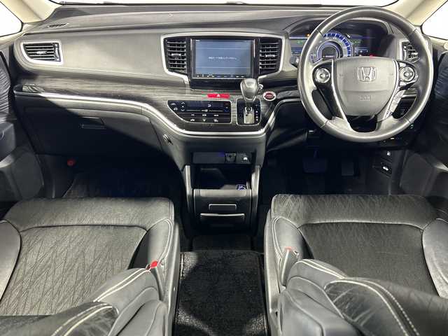 ホンダ オデッセイ ハイブリッド アブソルート ホンダセンシング 神奈川県 2016(平28)年 6.5万km プレミアムヴィーナスブラックP 純正８型SDナビゲーション【VXM-175VFNi】/フルセグ　CD DVD　SDMUSICRACK　AM FM/バックカメラ/両側電動スライドドア【サンシェード】/ホンダセンシング/衝突軽減ブレーキ/歩行者事故低減ステアリング/アダブティブクルーズコントロール/LKAS車線維持支援システム/路外逸脱抑制機能/誤発進抑制機能/先行車発進お知らせ機能/標識認識機能/前後ソナー/コンフォートビューパッケージ/ECON/EVモード/純正前方ドライブレコーダー/純正ビルトインETC/ブラックプライムスムース合皮/ファブリックコンビシート/運転席パワーシート/２列目オットマン/革巻きステアリング/プッシュスタート/スマートキー/LEDヘッドランプ/オートライト/フロントフォグランプ/純正リアスポイラー/純正17インチアルミホイール