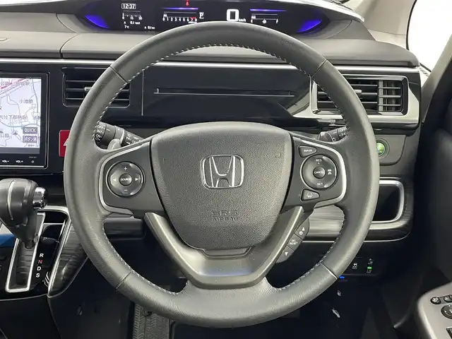 ホンダ ステップワゴン スパーダ クルスピセンシング 大分県 2015(平27)年 6.2万km ホワイトオーキッドパール 純正9インチインターナビ/フルセグTV/ーDISC/ーBluetooth/バックカメラ/ハーフレザー/両側パワースライドドア/ホンダセンシング/衝突軽減ブレーキ/先行車発進お知らせ機能/ACC先行車検知音/標識認識機能/路外逸脱抑制システム/LEDヘッドライト/無限エアロ/純正フリップダウンモニター/レーダークルーズコントロール/オートライト/純正16インチアルミホイール/純正フロアマット/ＥＴＣ/ドライブレコーダー/前席シートヒーター/横滑り防止装置