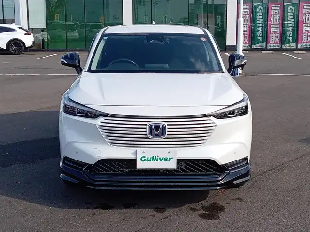 ホンダ ヴェゼル ハイブリッド e:HEV Z 福井県 2021(令3)年 1.9万km プラチナホワイトパール 純正9インチナビ/AM/FM/フルセグ/BT/USB/バックカメラ/無限エアロ/アダプティブクルーズコントロール/前後コーナーセンサー/衝突被害軽減システム/BSM/レーンキープアシスト/横滑り防止装置/ETC２．０/ワイヤレス充電/前後ドライブレコーダー/SOSボタン/前席シートヒーター/オートブレーキホールド/ハーフレザーシート/ステアリングヒーター/電動リアゲート/純正フロアマット/パドルシフト/純正18インチAW/LEDヘッドライト/スマートキー