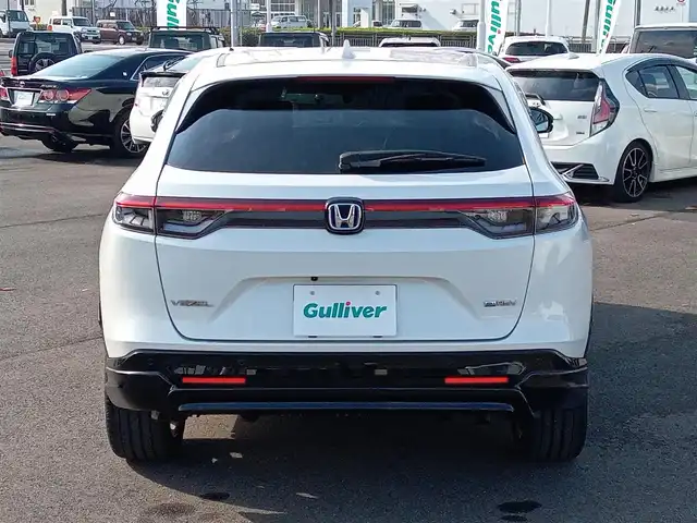 ホンダ ヴェゼル ハイブリッド e:HEV Z 福井県 2021(令3)年 1.9万km プラチナホワイトパール 純正9インチナビ/AM/FM/フルセグ/BT/USB/バックカメラ/無限エアロ/アダプティブクルーズコントロール/前後コーナーセンサー/衝突被害軽減システム/BSM/レーンキープアシスト/横滑り防止装置/ETC２．０/ワイヤレス充電/前後ドライブレコーダー/SOSボタン/前席シートヒーター/オートブレーキホールド/ハーフレザーシート/ステアリングヒーター/電動リアゲート/純正フロアマット/パドルシフト/純正18インチAW/LEDヘッドライト/スマートキー