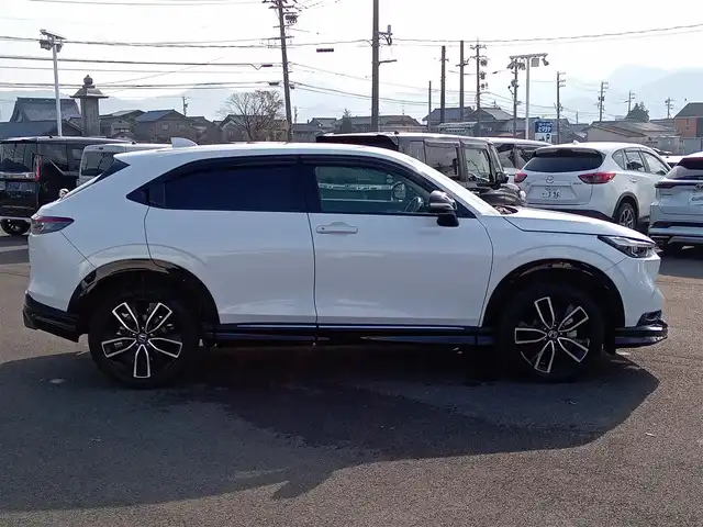 ホンダ ヴェゼル ハイブリッド e:HEV Z 福井県 2021(令3)年 1.9万km プラチナホワイトパール 純正9インチナビ/AM/FM/フルセグ/BT/USB/バックカメラ/無限エアロ/アダプティブクルーズコントロール/前後コーナーセンサー/衝突被害軽減システム/BSM/レーンキープアシスト/横滑り防止装置/ETC２．０/ワイヤレス充電/前後ドライブレコーダー/SOSボタン/前席シートヒーター/オートブレーキホールド/ハーフレザーシート/ステアリングヒーター/電動リアゲート/純正フロアマット/パドルシフト/純正18インチAW/LEDヘッドライト/スマートキー