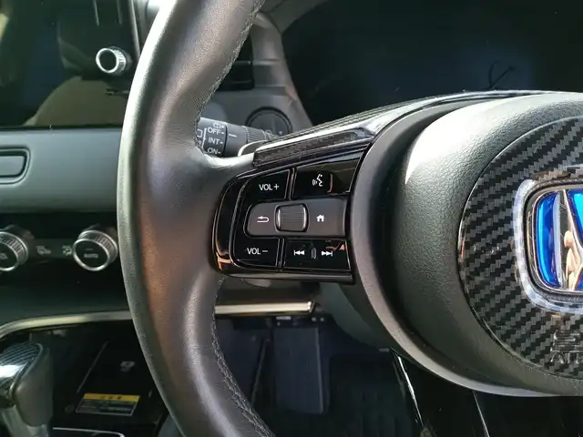 ホンダ ヴェゼル ハイブリッド e:HEV Z 福井県 2021(令3)年 1.9万km プラチナホワイトパール 純正9インチナビ/AM/FM/フルセグ/BT/USB/バックカメラ/無限エアロ/アダプティブクルーズコントロール/前後コーナーセンサー/衝突被害軽減システム/BSM/レーンキープアシスト/横滑り防止装置/ETC２．０/ワイヤレス充電/前後ドライブレコーダー/SOSボタン/前席シートヒーター/オートブレーキホールド/ハーフレザーシート/ステアリングヒーター/電動リアゲート/純正フロアマット/パドルシフト/純正18インチAW/LEDヘッドライト/スマートキー