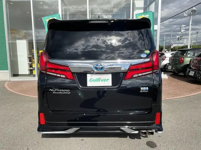 トヨタ アルファードハイブリット エグゼクティブ ラウンジ S 道央・札幌 2020(令2)年 1.9万km ブラック 登録時走行距離　18421km/　4　W　D　/純正メモリナビ(AM/FM/BT)/フルセグテレビ(走行中視聴可)/全方位モニター/ウィンカーミラー/ルーフカラーイルミネーション/キャプテンシート/クルーズコントロール(追従走行あり)/純正フリップダウンモニター/ドアバイザー/プッシュスタート/両側パワースライドドア/ビルトインETC/シートメモリ/ステアリングスイッチ/ステアリングヒーター/オートブレーキホールド/ルームミラーモニター/後席オットマン/キャプテンシート/コーナーセンサー/シートヒーター/フォグランプ/エンジンスターター