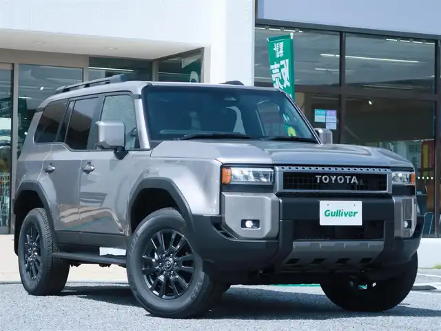 トヨタ ランドクルーザー ２５０ VX 千葉県 2025(令7)年 0.1千km アバンギャルドブロンズメタリック 登録済未使用車/トヨタチームメイト/・ドライバーモニターカメラ/・緊急時操舵支援/・フロントクロストラフィックアラート（FCTA）/・レーンチェンジアシスト（LCA）/ルーフレール/デジタルインナーミラー/ドライブレコーダー/12.3インチディスプレイオーディオ/・フルセグTV/・マルチビューカメラ/・Bluetooth/トヨタセーフティセンス/・プリクラッシュセーフティ/・レーントレーシングアシスト/・レーンディパーチャーアラート/・レーダークルーズコントロール/・アダクティブハイビームアシスト/・ロードサインアシスト/・ドライバー異常対応システム/・プロアクティブドライビングアシスト/・発進遅れ告知機能/・緊急操舵支援/・フロントクロストラフィックアラート/・レーンテェンジアシスト/LEDヘッドライト/フォグライト/シートヒーター/ベンチレーション/ステアリングヒーター/クロレザーシート/パワーバックドア/ETC2.0/ブレーキホールド/プッシュスタート/スマートキー×2/保証書