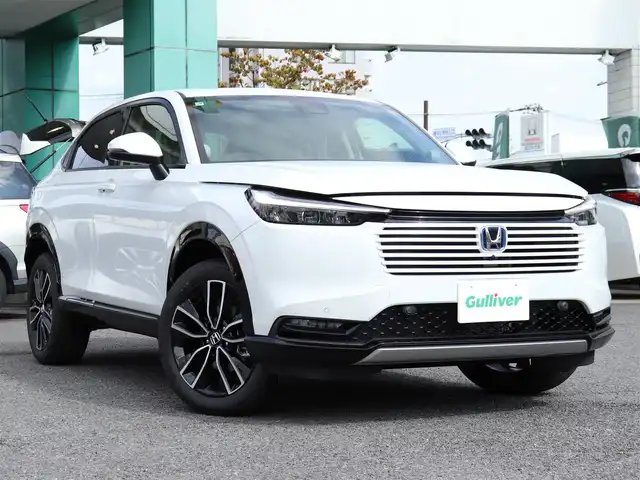 ホンダ ヴェゼル ハイブリッド e:HEV Z 神奈川県 2025(令7)年 0.1千km プラチナホワイトパール ワンオーナー/Honda SENSING/ブラインドスポットインフォメーション/アダプティブドライビングビーム(ADB)/後退出庫サポート/Honda CONNECTディスプレー＋ETC2.0車載器＋ワイヤレス充電器/運転席助手席シートヒーター/ハンズフリーアクセスパワーテールゲート(予約クローズ機能付)/LEDシーケンシャルターンシグナルランプ/マルチビューカメラシステム＋プレミアムオーディオ/18インチアルミホイール/コンビシート/本革巻きステアリング/保証書/取説、ナビ説/スペアスマートキー