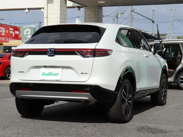 ホンダ ヴェゼル ハイブリッド e:HEV Z 神奈川県 2025(令7)年 0.1千km プラチナホワイトパール ワンオーナー/Honda SENSING/ブラインドスポットインフォメーション/アダプティブドライビングビーム(ADB)/後退出庫サポート/Honda CONNECTディスプレー＋ETC2.0車載器＋ワイヤレス充電器/運転席助手席シートヒーター/ハンズフリーアクセスパワーテールゲート(予約クローズ機能付)/LEDシーケンシャルターンシグナルランプ/マルチビューカメラシステム＋プレミアムオーディオ/18インチアルミホイール/コンビシート/本革巻きステアリング/保証書/取説、ナビ説/スペアスマートキー